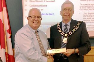 Wayne Orr receiving his nameplate from Mayor Ron Vandewal